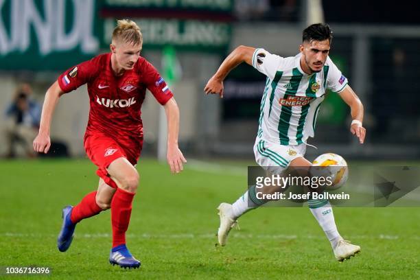 Nikolay Rasskazov of Spartak Moscow and Andrei Ivan of Rapid compete for the ball during the UEFA Europa League match between SK Rapid Wien v Spartak...