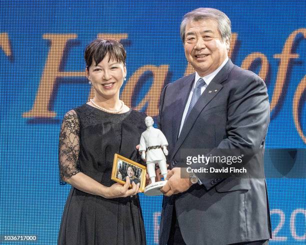 Mrs Saito receives the porcelain statue of Professor Jigoro Kano on behalf of her late husband, double Olympic champion, Hitoshi Saito from Japanese...