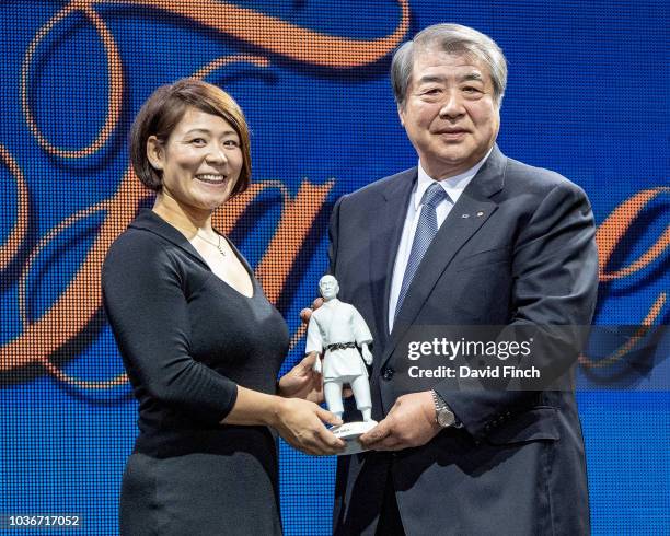 Double Olympic champion, Ayumi Tanimoto of Japan receives the porcelain statue of Professor Jigoro Kano from Japanese Judo Association chairman,...