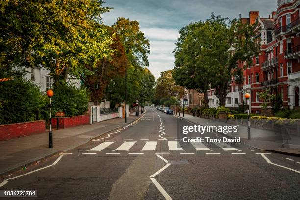 abbey road with the most famous road crossing in the world - abbey road london stock-fotos und bilder