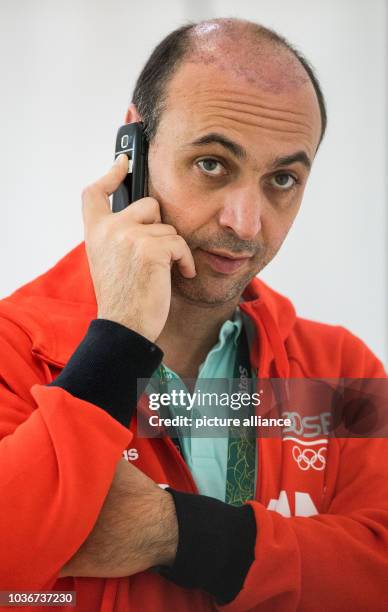 Bob Hanning, vice-president of the Handball Association of Germany , receives a phone call during a training session of the national handball team in...