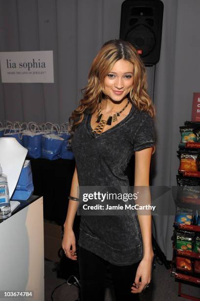 Model Kylie Bisutti with Pop Chips at the Lia Sophia Jewelry booth at the Lia Sophia Lounge at The Lift on January 24, 2010 in Park City, Utah.