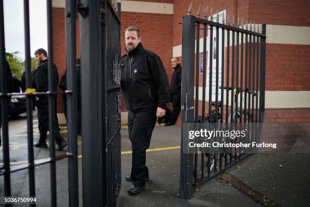 Prison Officers from Manchester Prison gather outside after staging a 'walk-out' on September 14, 2018 in Manchester, England. The Prison Officers...