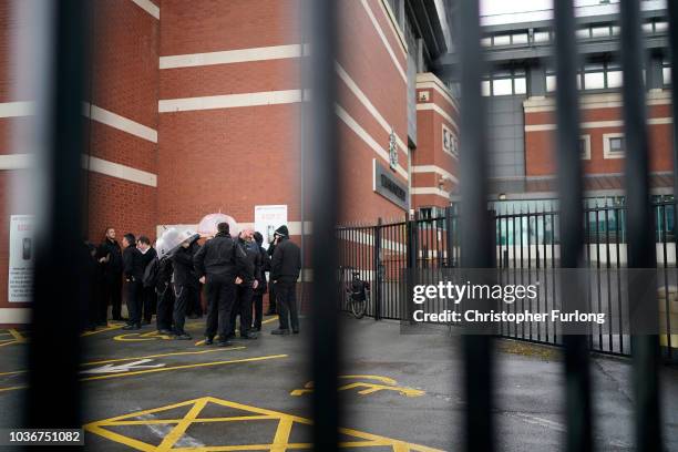 Prison Officers from Manchester Prison gather outside after staging a 'walk-out' on September 14, 2018 in Manchester, England. The Prison Officers...