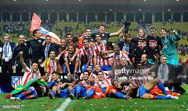 Atletico Madrid celebrate victory during the UEFA Super Cup between Inter and Atletico Madrid at Louis II Stadium on August 27, 2010 in Monaco,...