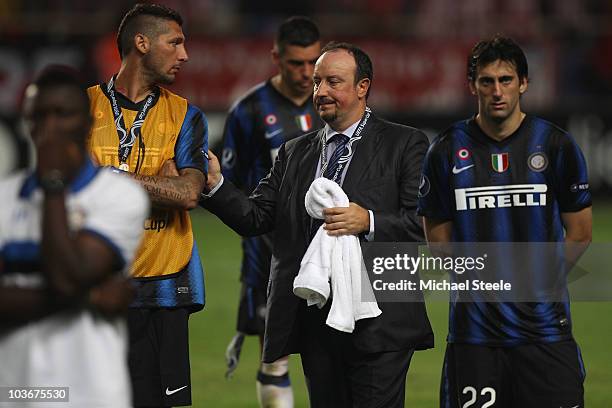 Rafael Benitez the Inter coach consoles Marco Materazzi as Diego Milito looks dejected after Inter's 0-2 defeat during the UEFA Super Cup match...