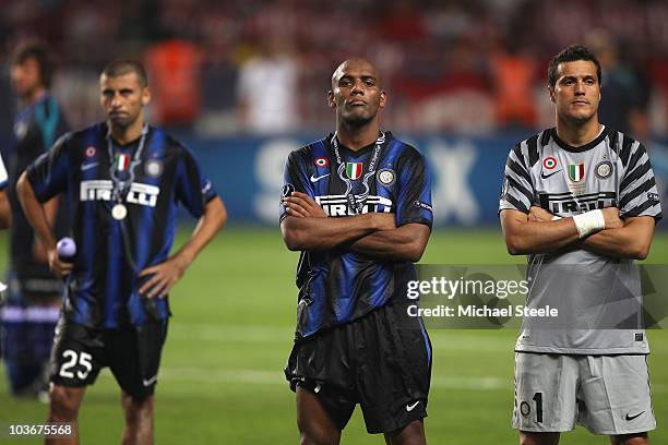 Maicon , Julio Cesar and Walter Samuel of Inter Milan stand dejected after their 0-2 defeat at the end of the UEFA Super Cup match between Inter...