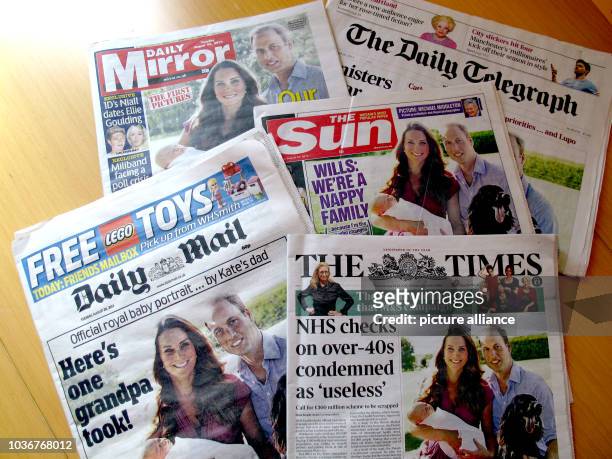 British daily newspapers 'Daily Mirror', 'The Daily Telegraph', 'Daily Mail' and 'The Times' published the first official photo of Prince George with...