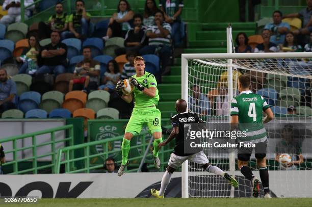 Romain Salin of Sporting CP with Innocent Emeghara of Qarabag FK in action during the UEFA Europa League - Group E match between Sporting CP and...