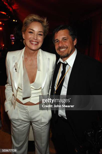 Actress Sharon Stone and celebrity photographer Kevin Mazur attends the 16th Annual Elton John AIDS Foundation Oscar Party sponsored by Ford at the...