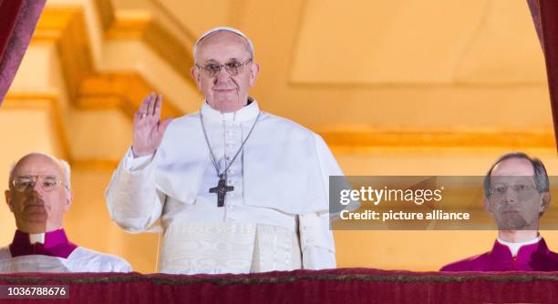 Cardinal Bergoglio , the newly elected pope, Pope Francis I greets pilgrims and well-wishers while standing on the balcony of St. Peter's Basilica...