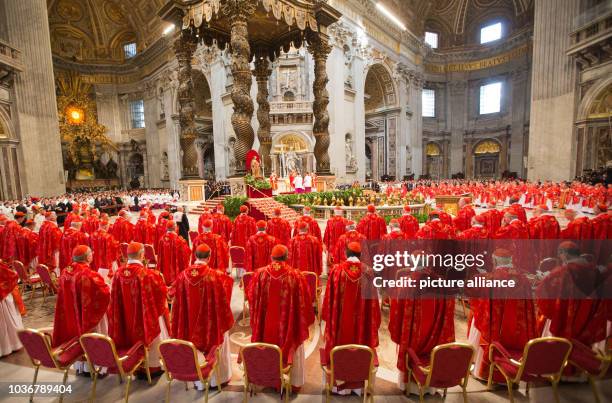 Cardinals attend the religious mass 'Pro Eligendo Romano Pontifice' at Saint Peter's Basilica in the Vatican, Vatican City, 12 March 2013. The...