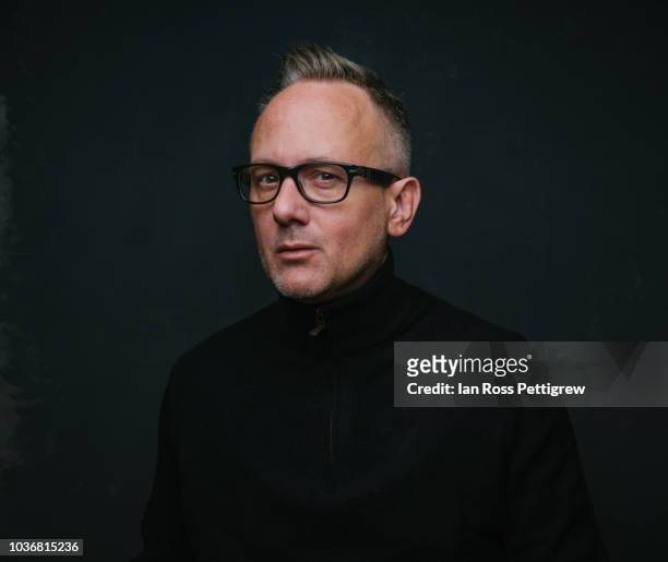 middle-aged man wearing black sweater on dark background - portrait professional dark background stock pictures, royalty-free photos & images