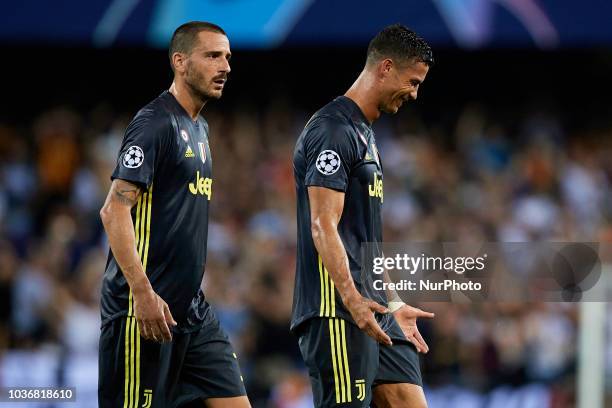 Cristiano Ronaldo of Juventus cries after taking a red card next to his teammate Leonardo Bonucci of Juventus during the UEFA Champions League group...