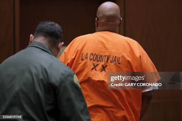 Marion Suge Knight exits court after after pleading no contest to voluntary manslaughter in front of Judge Ronald S. Coen at the Criminal Justice...