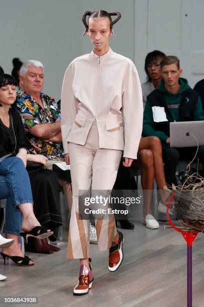 Model walks the runway at the Kiko Kostadinov Show during London Fashion Week September 2018 at XXXX on September 14, 2018 in London, England.