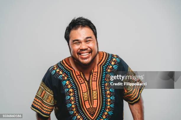 studio portrait of a funny malaysian man - hawaiian culture stock pictures, royalty-free photos & images