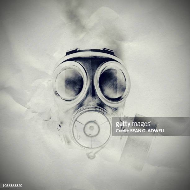 gas mask on paper texture - terrorism concept stock pictures, royalty-free photos & images