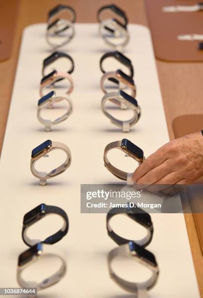 Hand touches the new Apple watch at the Australian release of the latest iPhone and Apple watch models at the Apple Store on September 21, 2018 in...