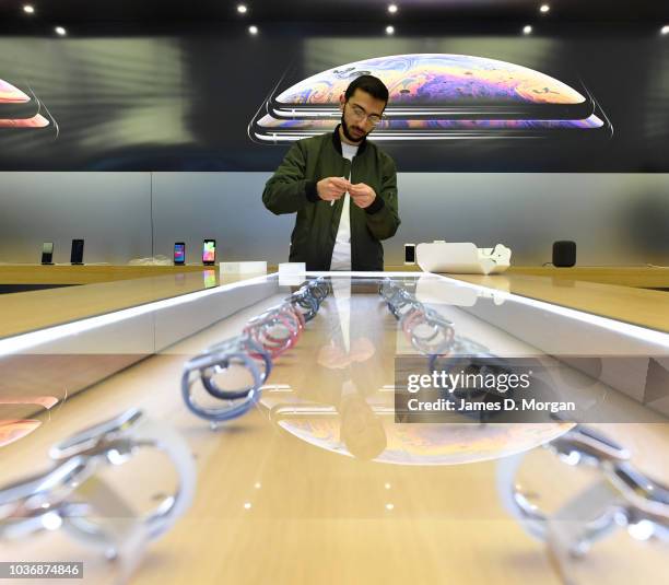 Customer celebrate his new purchase of an Apple watch at the Australian release of the latest iPhone and Apple watch models at the Apple Store on...