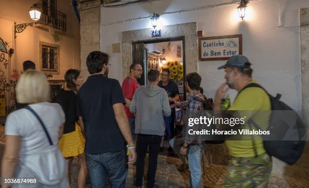 Tourists wait outside Cantinho do Bem Estar restaurant near Praca Camoes during the city's Noite Branca on September 20, 2018 in Lisbon, Portugal....