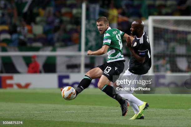 Sporting's defender Stefan Ristovsk from Macedonia vies with Qarabag's forward Innocent Emeghara during the UEFA Europa League Group E football match...