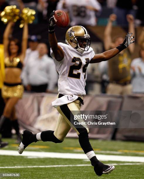 Leigh Torrence of the New Orleans Saints celebrates as he scores a touchdown off an interception against the San Diego Chargers at the Louisiana...