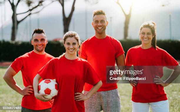 mixed soccer team together on the field - team captain sport stock pictures, royalty-free photos & images