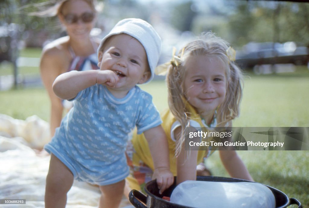 Kids cooling off in the park on hot summer day