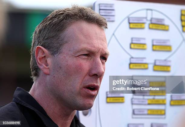 Collingwood coach Gavin Brown talks to his players at the break during the VFL second Elimination Final match between the Northern Bullants and...