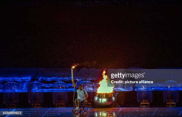 Clodoaldo Silva lights the cauldron during the Opening Ceremony of the Rio 2016 Paralympic Games, Rio de Janeiro, Brazil, 07 September 2016. Photo:...