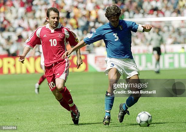 Paolo Maldini of Italy holds off Sergen Yalcin of Turkey during the European Championships 2000 group match at the Gelredome in Arnhem, Holland....