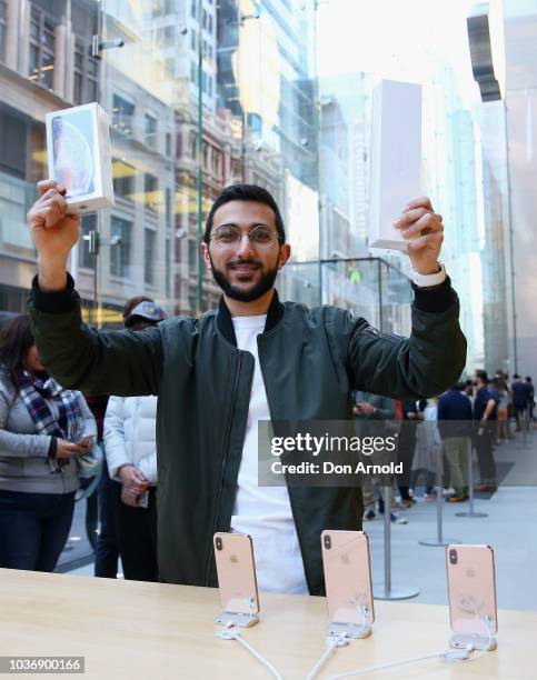 Mazen Kourouche poses with his iPhone Xs during the Australian release of the latest iPhone models at Apple Store on September 21, 2018 in Sydney,...