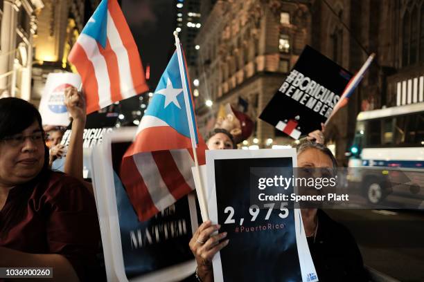 People march to Trump Tower following a service at St. Bartholomew's Church for the one year anniversary of Hurricane Maria which cut through Puerto...