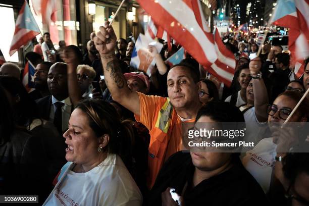 People march to Trump Tower following a service at St. Bartholomew's Church for the one year anniversary of Hurricane Maria which cut through Puerto...