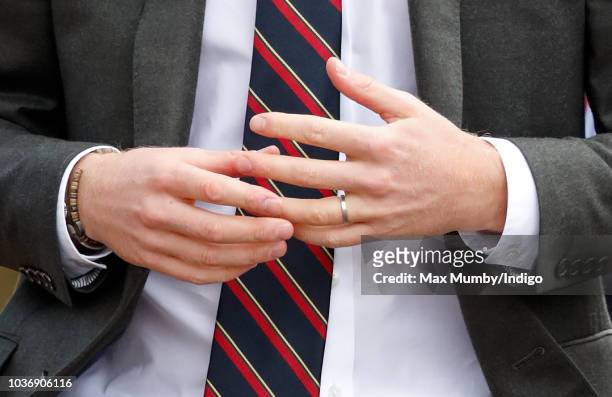 Prince Harry, Duke of Sussex seen fiddling with his wedding ring as he visits The Royal Marines Commando Training Centre on September 13, 2018 in...