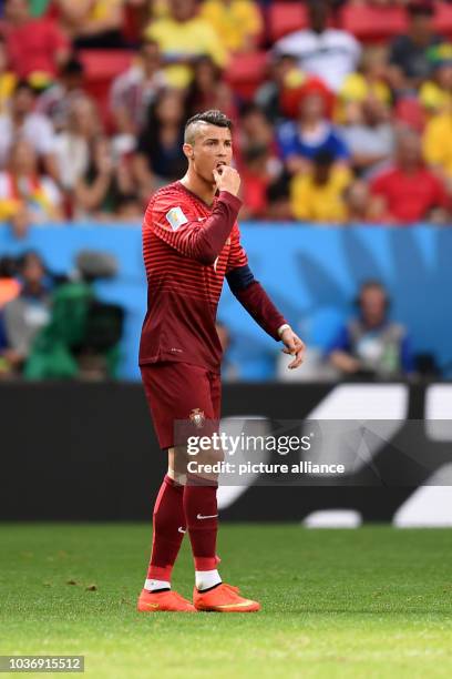 Cristiano Ronaldo of Portugal reacts during the FIFA World Cup 2014 group G preliminary round match between Portugal and Ghana at the Estadio...