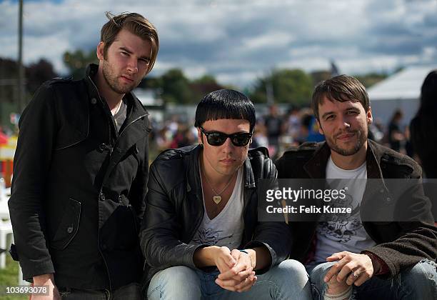 Ross Jarman, Ryan Jarman and Gary Jarman of English rockband The Cribs relax backstage on day two of the Reading Festival at Richfield Avenue on...