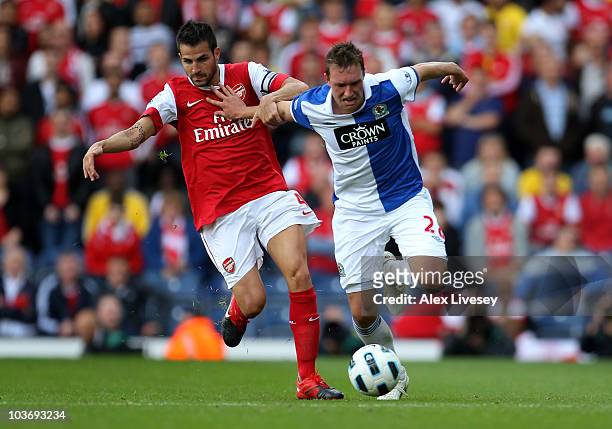 Phil Jones of Blackburn Rovers battles for the ball with Cesc Fabregas of Arsenal during the Barclays Premier League match between Blackburn Rovers...