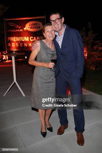Willi Bonke, Premium Cars Rosenheim and Hedi Speth, wife of CEO Jaguar Land Rover Ralf Speth during a vernissage with artwork by artist Mauro...
