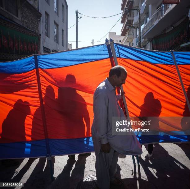 Muslims hold a banner during the annual commemoration Ashura in Pireaus , 20 September 2018. Hundreds of Shiite Muslims gathered in Piraeus to...