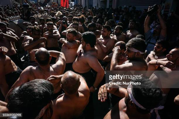 Shiite Muslims perform during the annual commemoration Ashura in Pireaus , 20 September 2018. Hundreds of Shiite Muslims gathered in Piraeus to...