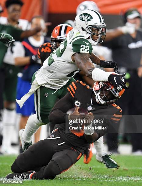 Tyrod Taylor of the Cleveland Browns gets hit while sliding by Trumaine Johnson of the New York Jets during the second quarterat FirstEnergy Stadium...