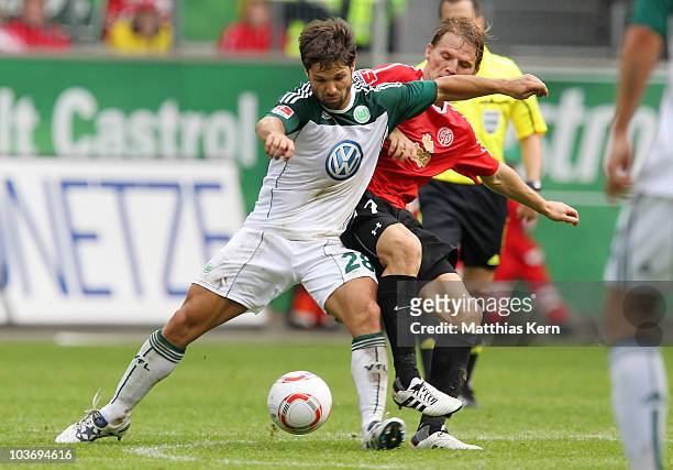 Eugen Polanski of Mainz battles for the ball with Diego Ribas da Cunha of Wolfsburg during the Bundesliga match between VFL Wolfsburg and FSV Mainz...