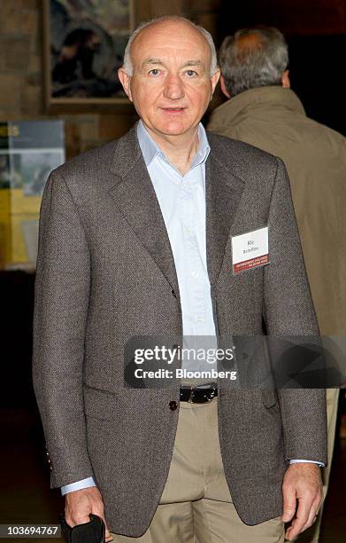 Ric Battellino, deputy governor of the Reserve Bank of Australia, arrives to the morning session of the Federal Reserve Bank of Kansas City annual...