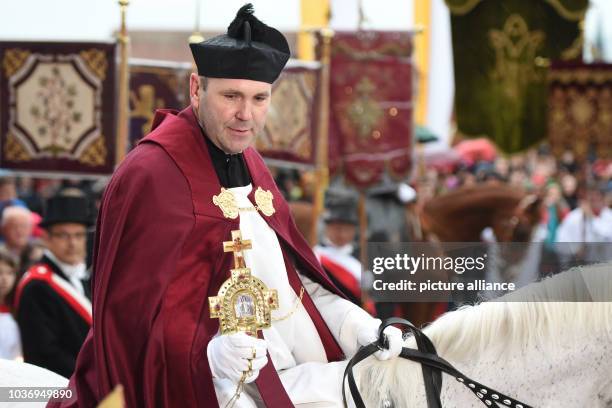 Dean Ekkehard Schmid carries the Relic of the Holy Blood during the so-called 'Blutritt' procession of the Holy Blood in Weingarten, Germany, 15 May...
