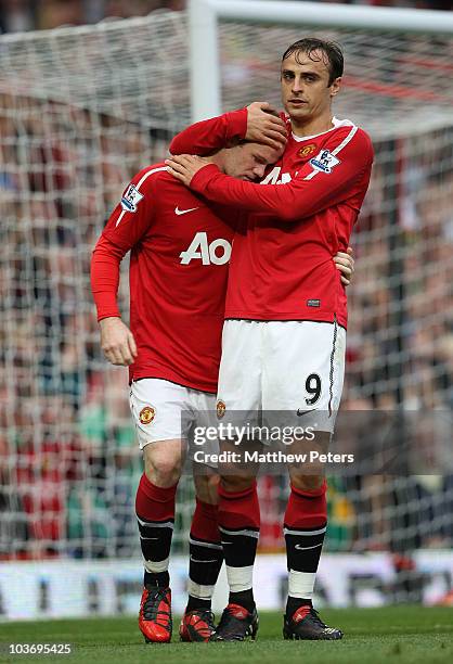 Wayne Rooney of Manchester United celebrates scoring their first goal with Dimitar Berbatov during the Barclays Premier League match between...