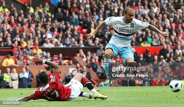 Nani of Manchester United clashes with Kieron Dyer of West Ham United during the Barclays Premier League match between Manchester United and West Ham...