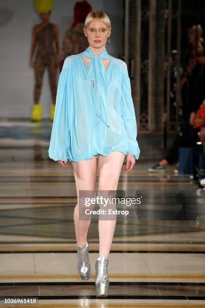 Model walks the runway at the Pam Hogg Show during London Fashion Week September 2018 at XXXX on September 14, 2018 in London, England.