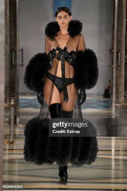 Model walks the runway at the Pam Hogg Show during London Fashion Week September 2018 at XXXX on September 14, 2018 in London, England.